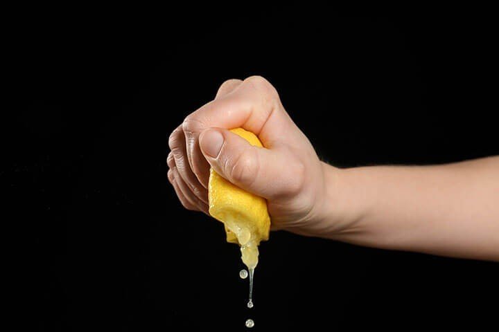 squeezing a lemon